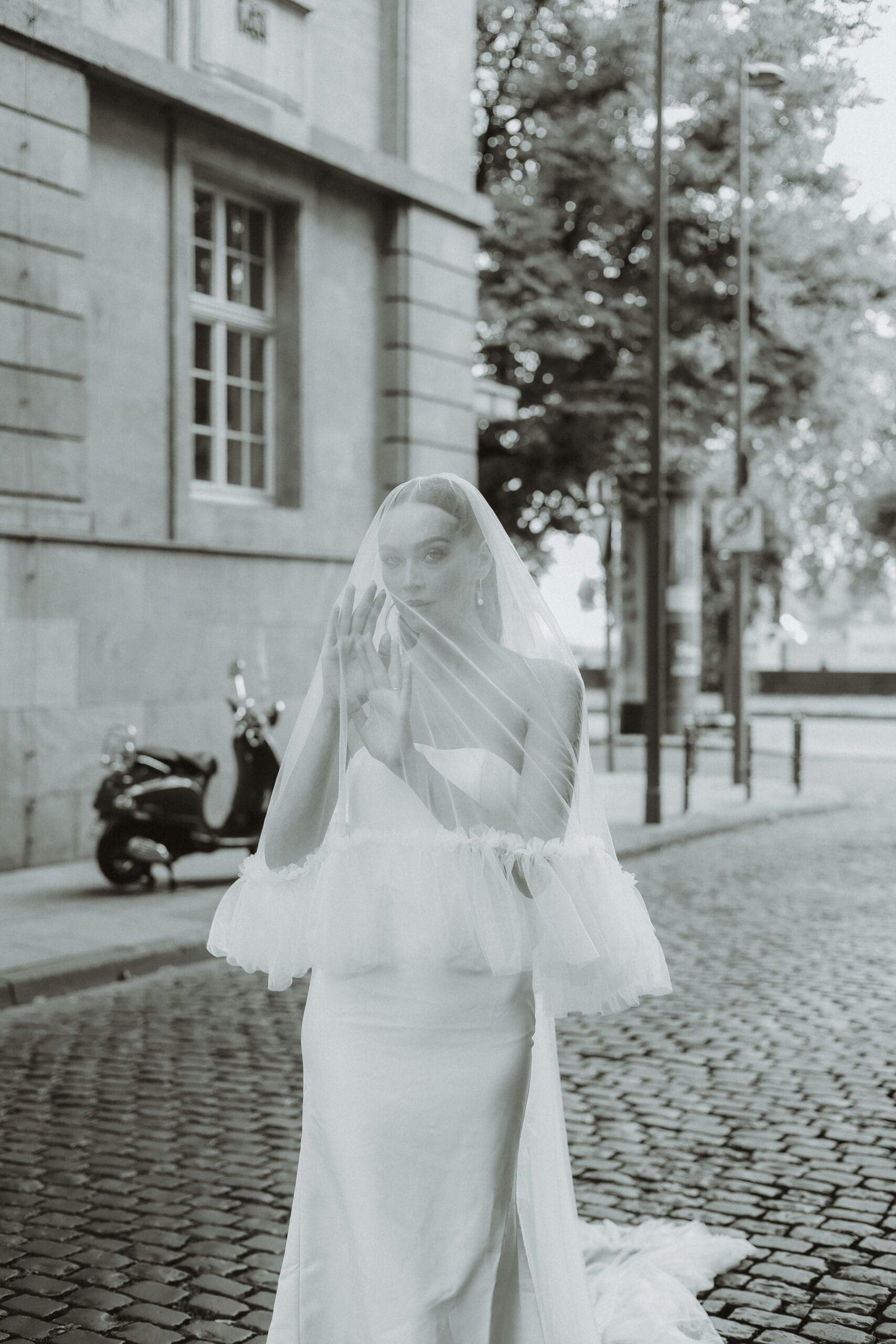 Bride on wedding day under veil in Italy