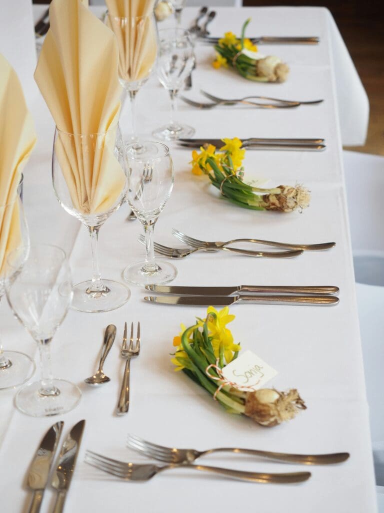 table setting with butter yellow and green color scheme